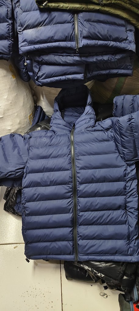 Navy puffer stacked loose